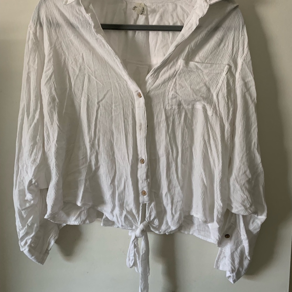 A cute white t-shirt with a bow at the front